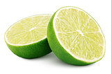 Two halves of green lime citrus fruit on white