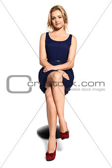 Attractive Young Woman Sitting on a Stool