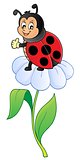 Happy ladybug on flower image 1