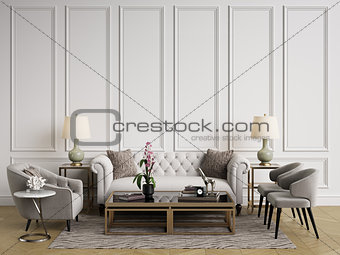 Classic interior.Sofa,chairs,sidetables with lamps,table with decor.White walls with mouldings