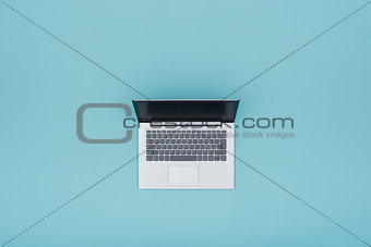 Laptop on light blue background