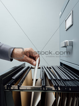 Office clerk searching for files