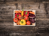 Fresh tasty vegetables in a wooden crate