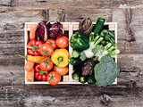 Fresh tasty vegetables in wooden crates
