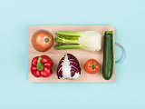 Fresh vegetables on a wooden chopping board