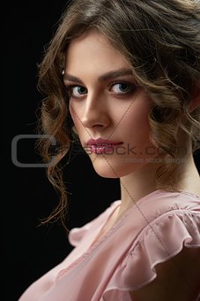 Portrait of a young pretty girl looking at camera.
