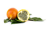 whole grenadilla yellow passion fruit half of the fruit with a juicy filling with many seeds