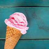 Strawberry ice cream in blue close up