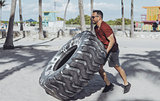 Man working out with tyre