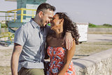 Happy multiracial couple on seafront
