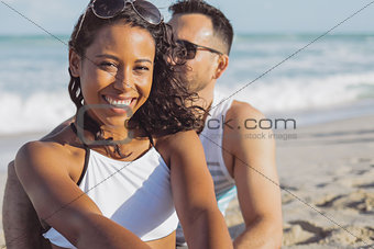 Pretty black girl with boyfriend on beach