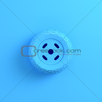 Car wheel on bright blue background