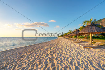 beach with wooden parasol 