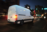 Fast van on a city road delivering at night. 3D Rendering