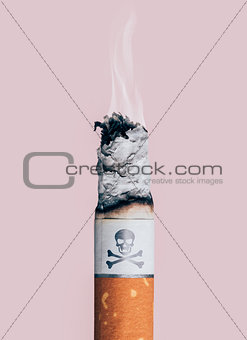 Cigarette burning with skull and bones symbol