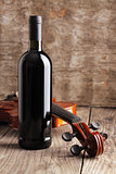 Red wine bottle and violin