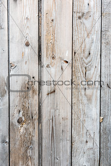 Old wooden vertical planks texture with scratches and cracks.