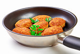 Cooked fried cutlets in pan isolated on white background