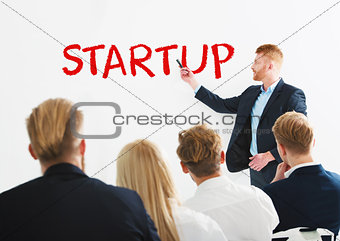 Businessman speaks about a new startup during a training meeting. Concept of success