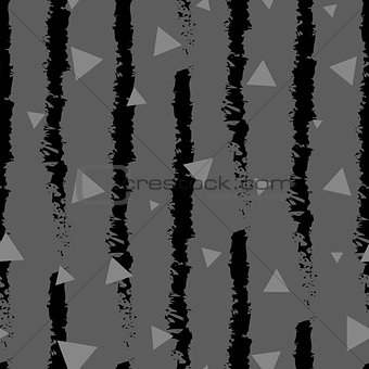 Dark triangles confetti seamless pattern on stripe background