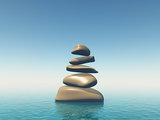3D balancing pebbles in blue ocean