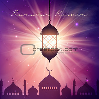 Ramadan Kareem background with hanging lantern and mosque silhou
