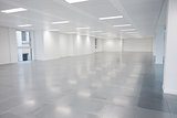Vacant open plan office space with lights on