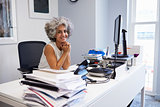 Middle aged businesswoman smiling to camera in her office