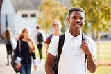 Portrait Of Male Teenage Student Walking Around College Campus
