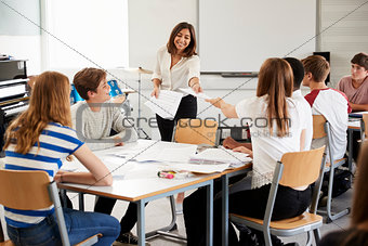 Teenage Students Studying In Music Class With Female Teacher