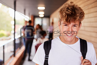 Portrait Of Male Teenage Student On College With Friends