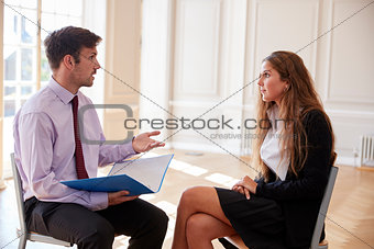 Female Teenage Student Having Discussion With Tutor