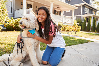 Portrait Of Girl With Dog On Suburban Street