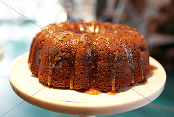 Freshly Baked Treacle Cake On Stand In Coffee Shop