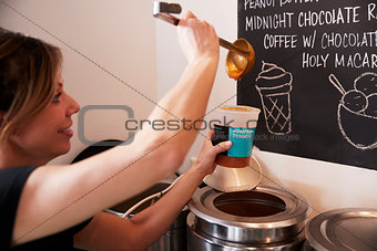Waitress In Coffee Shop Serving Homemade Soup