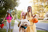 Children And Dog In Halloween Costumes For Trick Or Treating