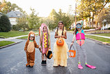 Children Wearing Halloween Costumes For Trick Or Treating