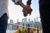 Couple Visiting New York With Manhattan Skyline In Background