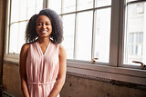 Smart young black businesswoman smiling to camera