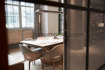 Empty boardroom at a business seen through glass wall