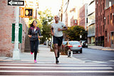 Young black couple jogging in Brooklyn street