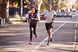 Young black couple jogging in a Brooklyn street