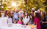Friends and family in garden celebrating a childÕs birthday