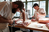 Three butchers preparing meat,cuts of meat in butcher's shop, close up