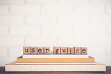 The word User guide and copy space background.