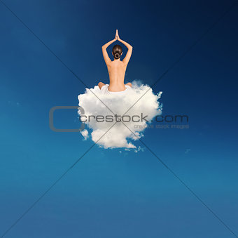 Young girl practices yoga over a cloud