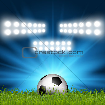 Football / soccer ball under spotlights