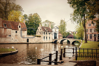 The Minnewater with bridge and entrance portal to the Bruges Beg