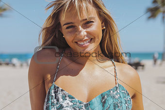 Charming laughing woman on shoreline