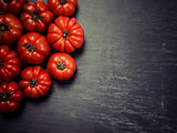 Marmande tomatoes on slate background